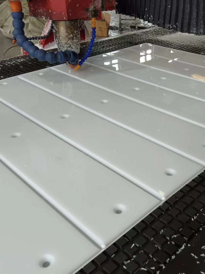 Flat machined UHMWPE piece showing no warping after cutting